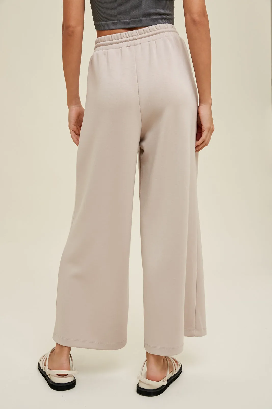 Scuba drawstring pants with side pockets and side slits